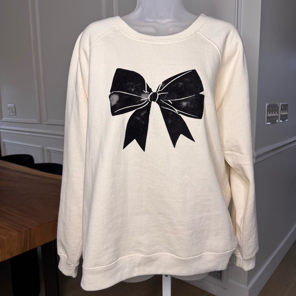 Cream Sweatshirt with Black Bow Design